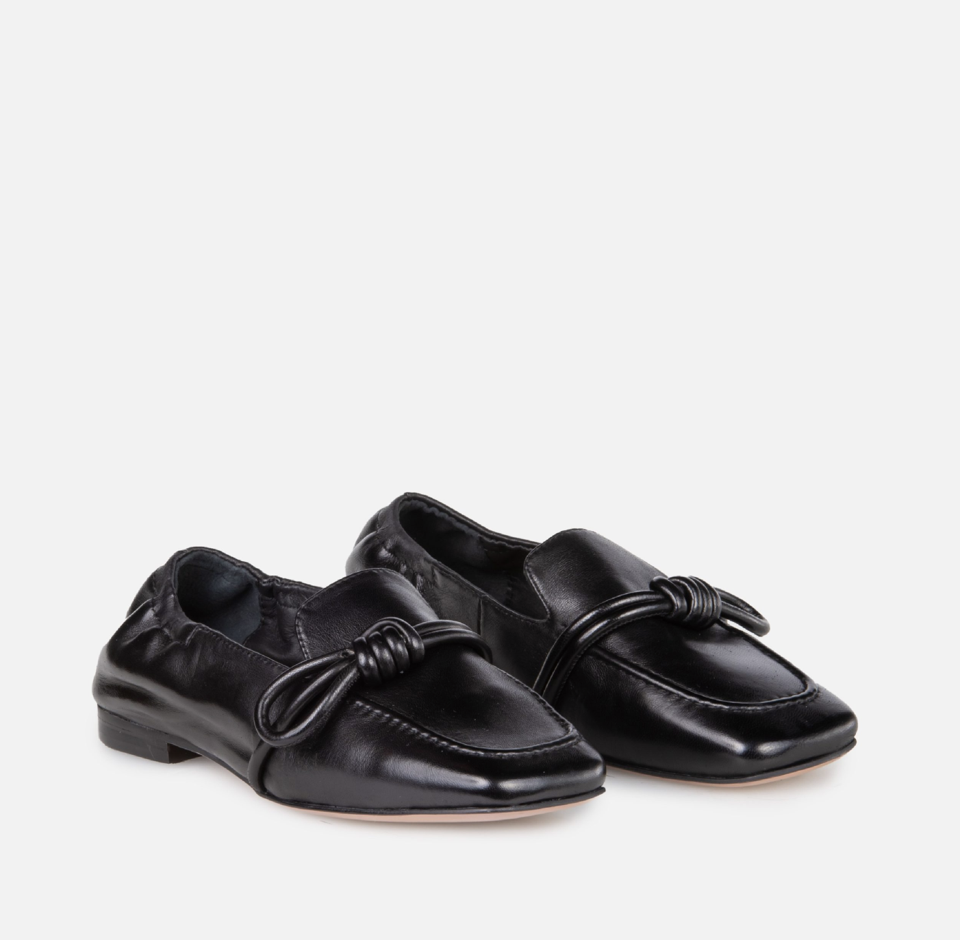 Side view of Carmelina black genuine leather loafers with flexible sole